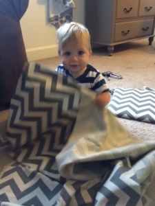 Baby P playing peek-a-boo with the fabric, lol!